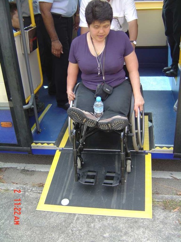 Accessibility issues consultant Judy Wee tries out the ramp in Singapore - image courtesy of Scania Malaysia / Rapid Penang