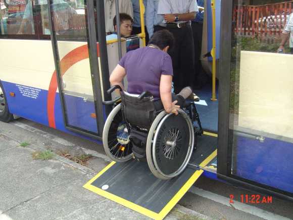 Accessibility issues consultant Judy Wee trying out the ramp at a test in Singapore - image courtesy of Scania Malaysia / Rapid Penang