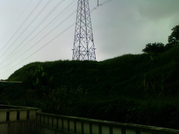 North facing view of powerline near houses in Subang Alam