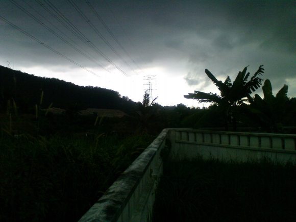 South facing view of powerline near houses in Subang Alam